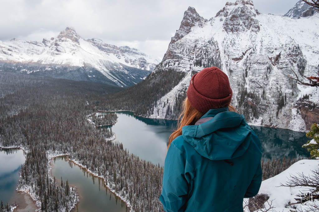 Winter vista of Lake O'Hara hiking trails with snow-capped peaks and turquoise waters viewed from Opabin Plateau, a highlight of the Lake O'Hara hiking itinerary