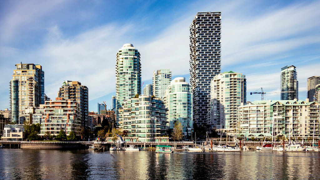 Modern waterfront high-rise buildings and marina in Yaletown Vancouver showing accommodation options